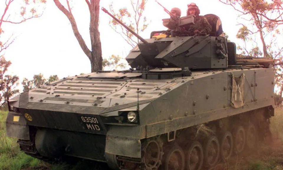 File photo of Singapore Armed Forces (SAF) personnel driving an SAF-made Bionix vehicle during an overseas exercise. PHOTO: ST FILE
