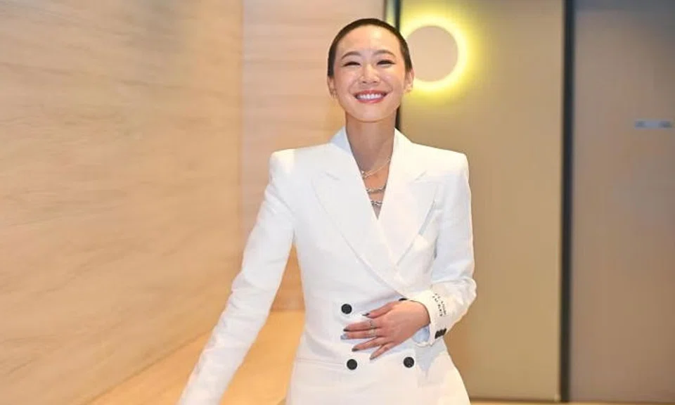 Actress Julie Tan shows off her buzz cut at a press conference for the local movie Good Goodbye on March 26. ST PHOTO: AZMI ATHNI