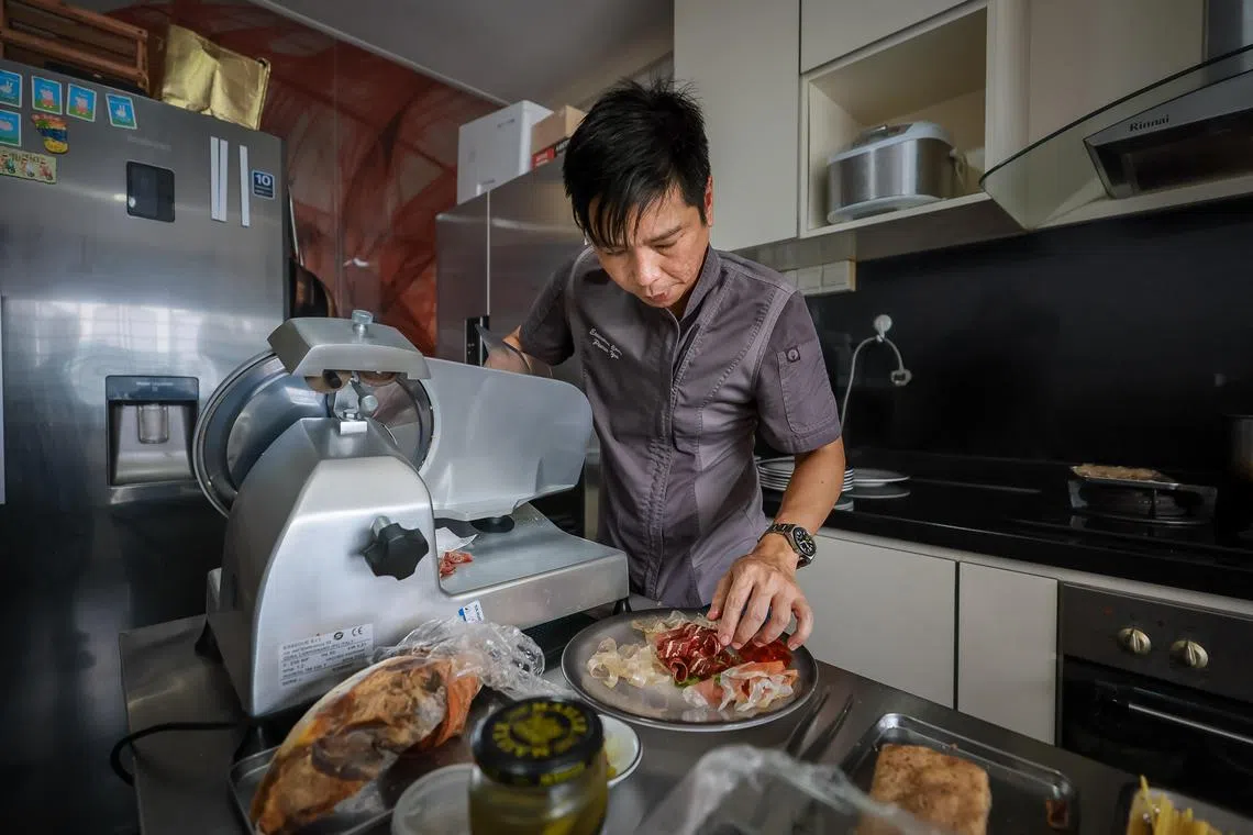 Private chef Pierce Yee, 47,  who was formerly the executive sous chef at Ristorante Da Valentino, cooking at his home, Oct 20, 2023.