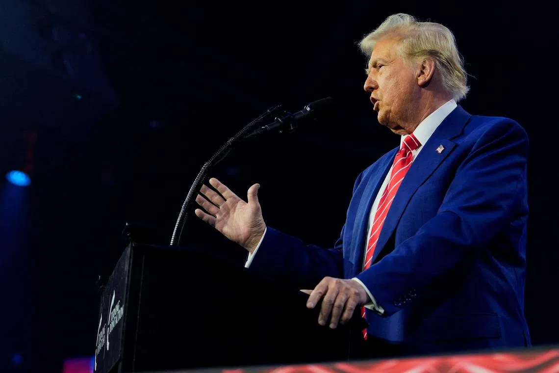 FILE PHOTO: U.S. President-elect Donald Trump speaks at Turning Point USA's AmericaFest in Phoenix, Arizona, U.S., December 22, 2024.  REUTERS/Cheney Orr/File Photo