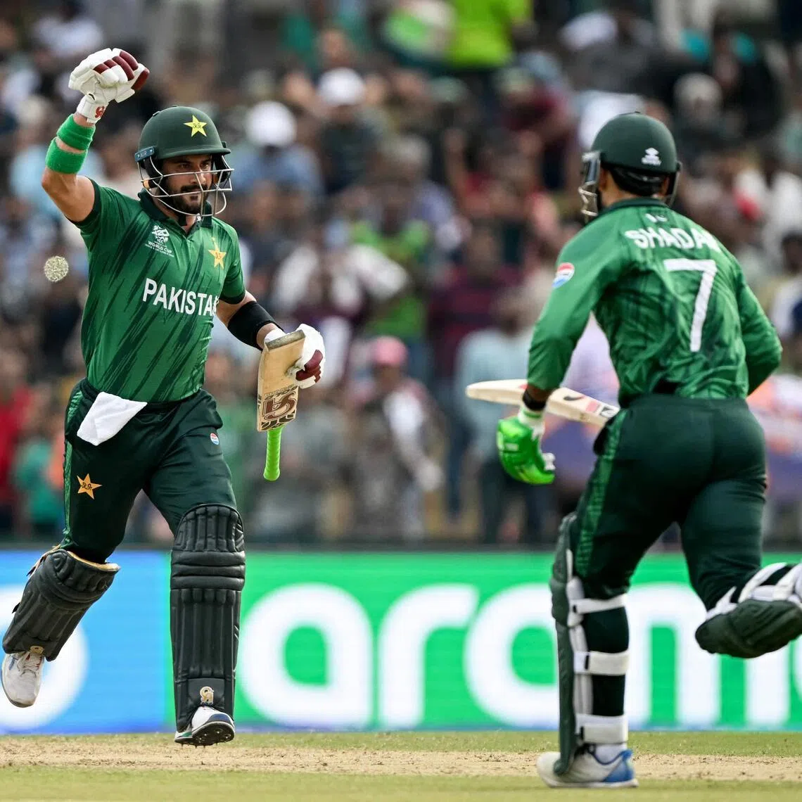 Pakistan's Sahibzada Farhan (left) celebrates with Shadab Khan after scoring a century in the ICC Men's T20 Cricket World Cup group-stage match against Namibia at the Sinhalese Sports Club Ground in Colombo on Feb 18, 2026.