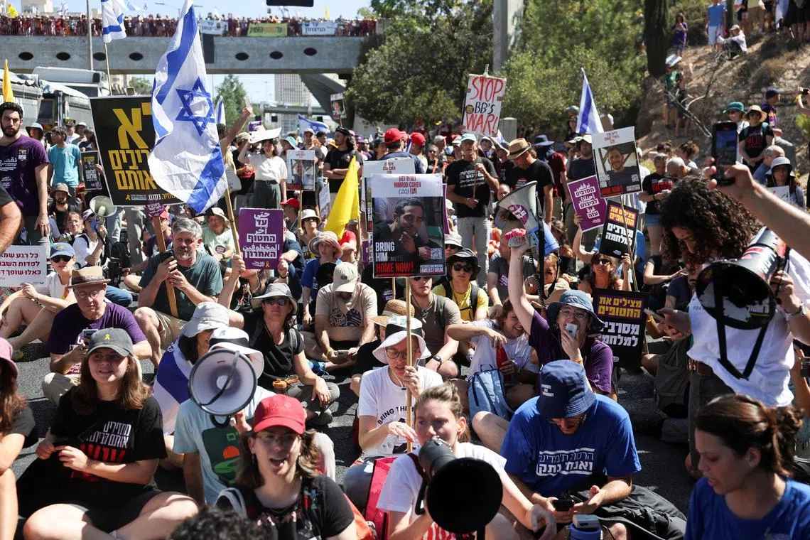 Demonstrators block a road during a protest in Israel on Aug 17, demanding an end to the war and the return of hostages.