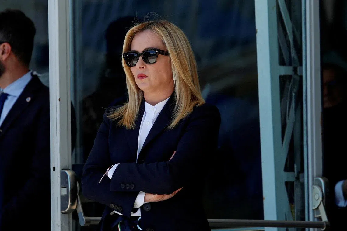 FILE PHOTO: Italian Prime Minister Giorgia Meloni waits to welcome Ukrainian Prime Minister Denys Shmyhal before a reconstruction meeting for war-battered Ukraine, in Rome, Italy, April 26, 2023. REUTERS/Remo Casilli/File Photo