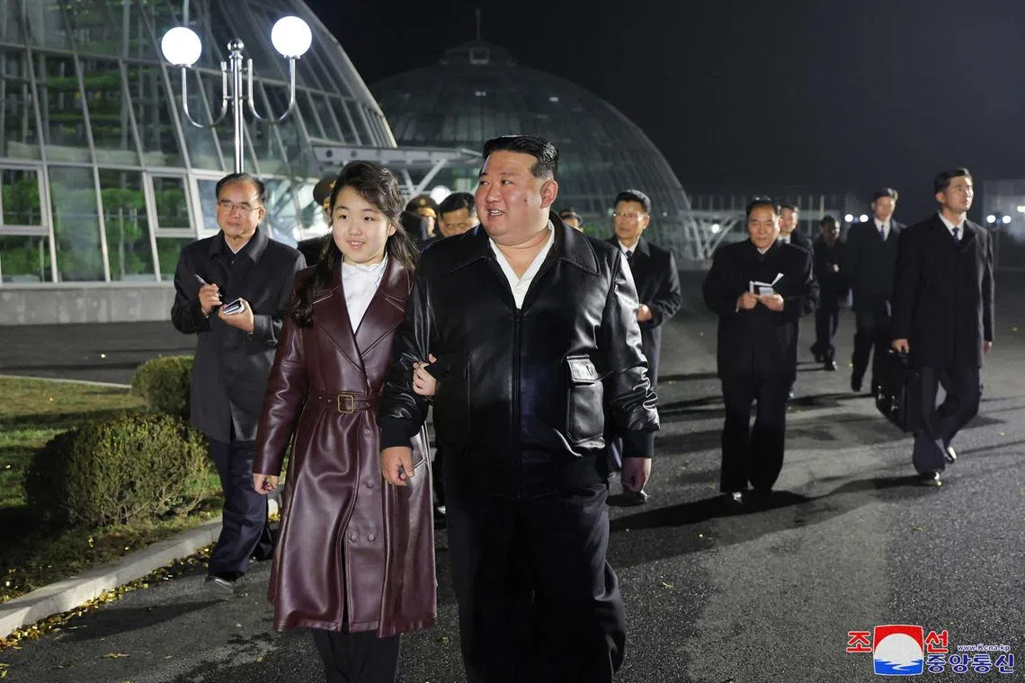 North Korean leader Kim Jong Un and his daughter Ju Ae visit a greenhouse complex in Pyongyang.