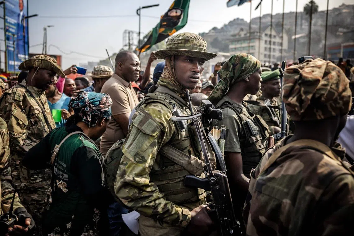 Members of the M23 movement monitoring the area while guarding senior members of the group during a special cleaning exercise and public meeting conducted by the M23 movement following the takeover of the city at the Place de l'Independance in Bukavu, on Feb 20, 2025. 