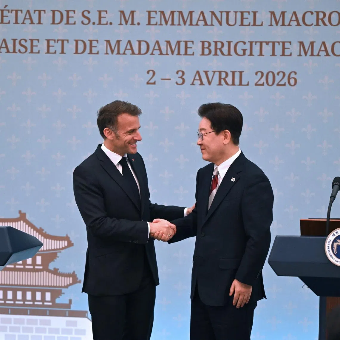 French President Emmanuel Macron (left) shaking hands with South Korean President Lee Jae Myung during a joint press conference in Seoul on April 3.