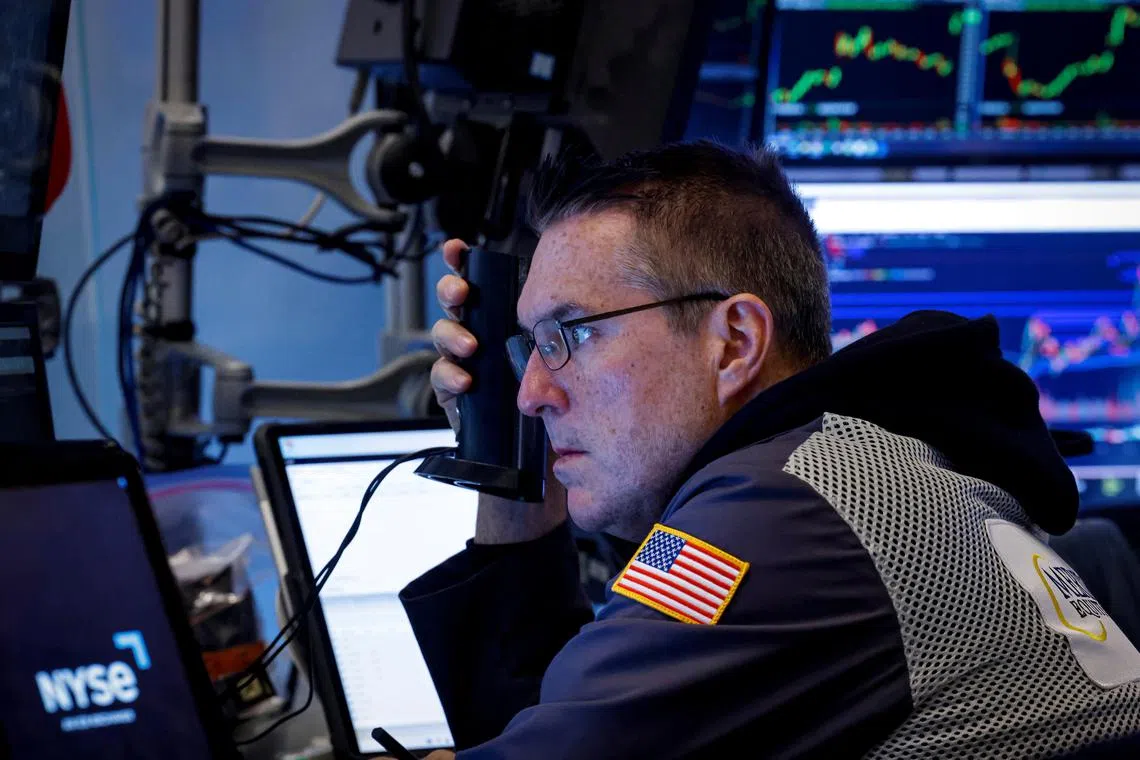 A trader working on the floor of the New York Stock Exchange, in New York City.