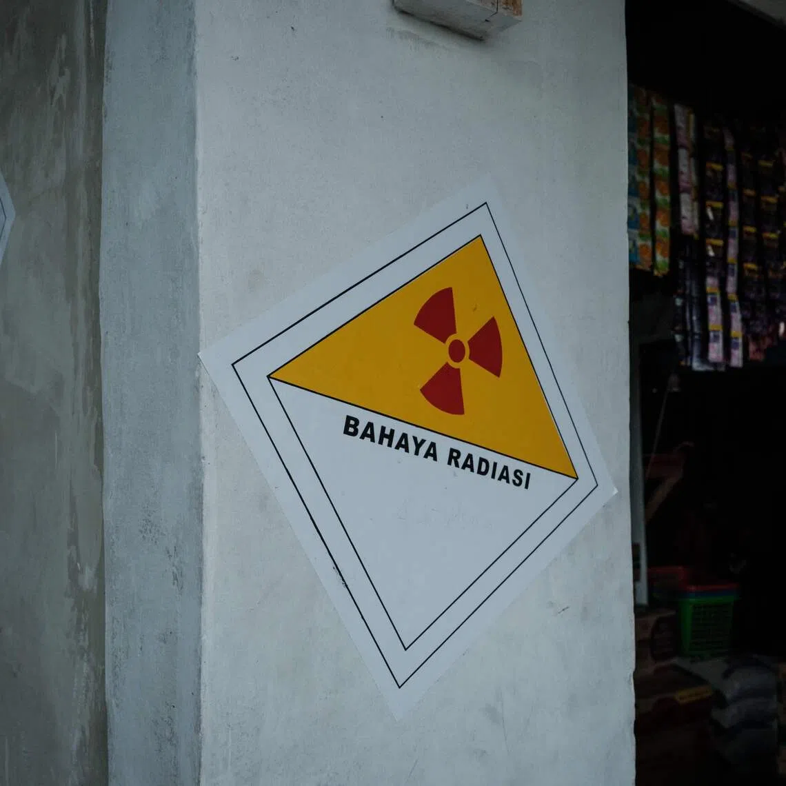 Stickers warning of radiation dangers on a house next to the Modern Cikande Industrial Estate, where Caesium-137 was detected, in Indonesia's Banten province on Oct 13.