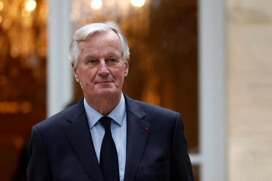 French Prime Minister Michel Barnier arrives for a family photo with members of the new government during a government meeting at the Hotel Matignon in Paris, France, September 27, 2024. REUTERS/Benoit Tessier/File Photo