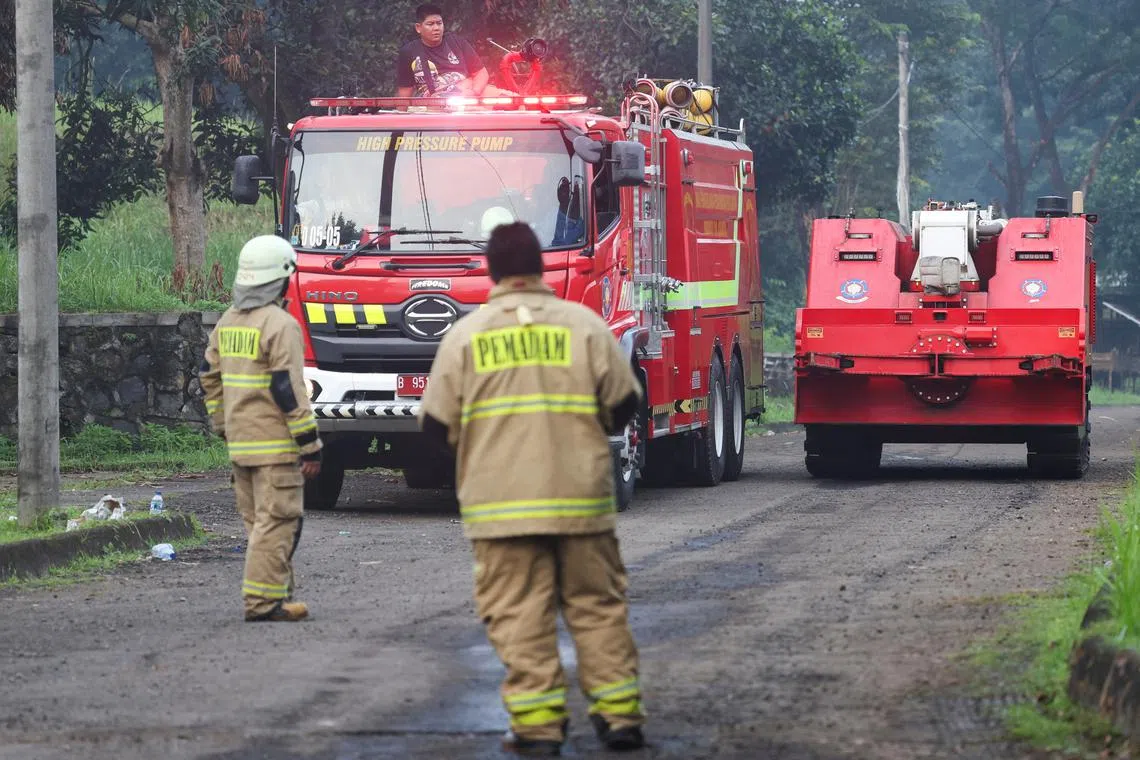 A firefighting robot passes after a massive fire broke out at a military ammunition facility in Bogor, on the outskirts of Jakarta, Indonesia, March 31, 2024. REUTERS/Ajeng Dinar Ulfiana