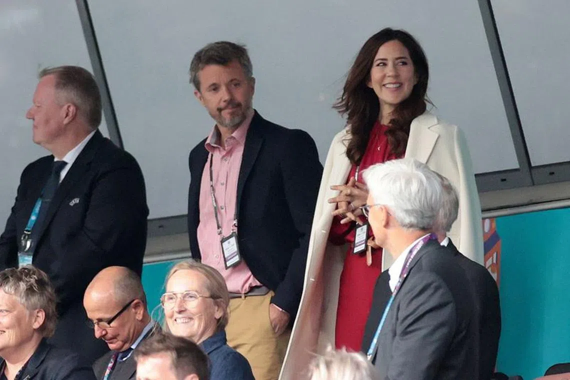 Soccer Football - Euro 2020 - Group B - Denmark v Finland - Parken Stadium, Copenhagen, Denmark - June 12, 2021. Picture taken June 12, 2021 Denmark's Crown Prince Frederik and his wife Mary Donaldson are seen in the stands Pool via REUTERS/Hannah Mckay/file photo
