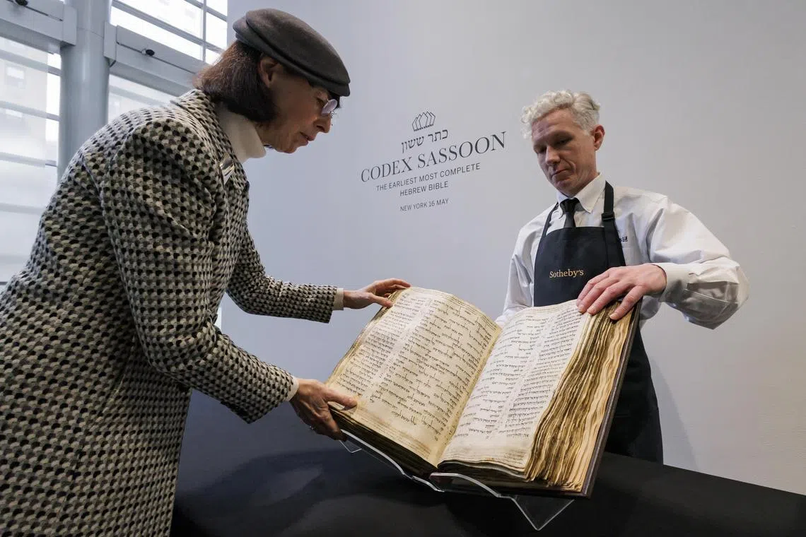 The Codex Sassoon, the earliest and most complete known Hebrew Bible, during an auction preview for the centuries-old manuscript at Sotheby’s in New York,