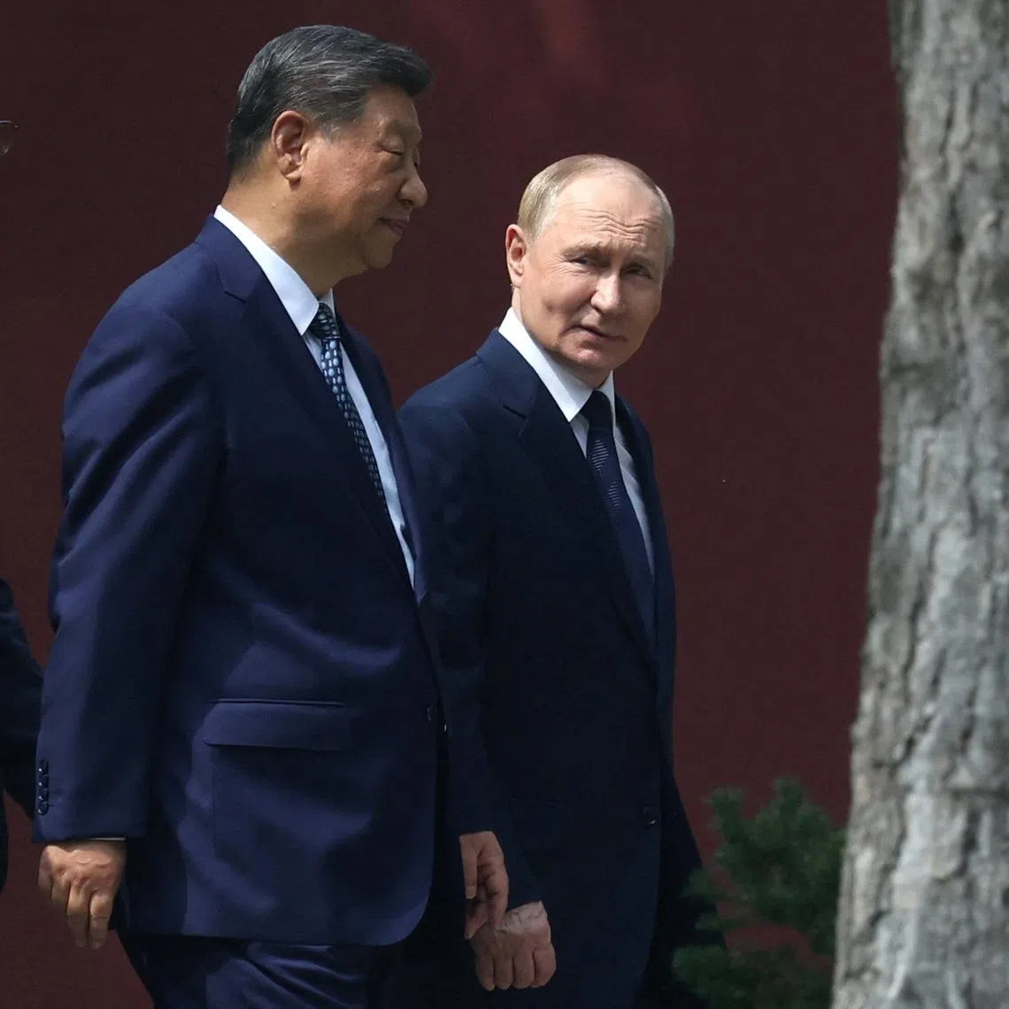 Chinese President Xi Jinping and Russian President Vladimir Putin walk at the personal residence of the Chinese leader Zhongnanhai in Beijing, China September 2, 2025. Sputnik/Alexander Kazakov/Pool via REUTERS