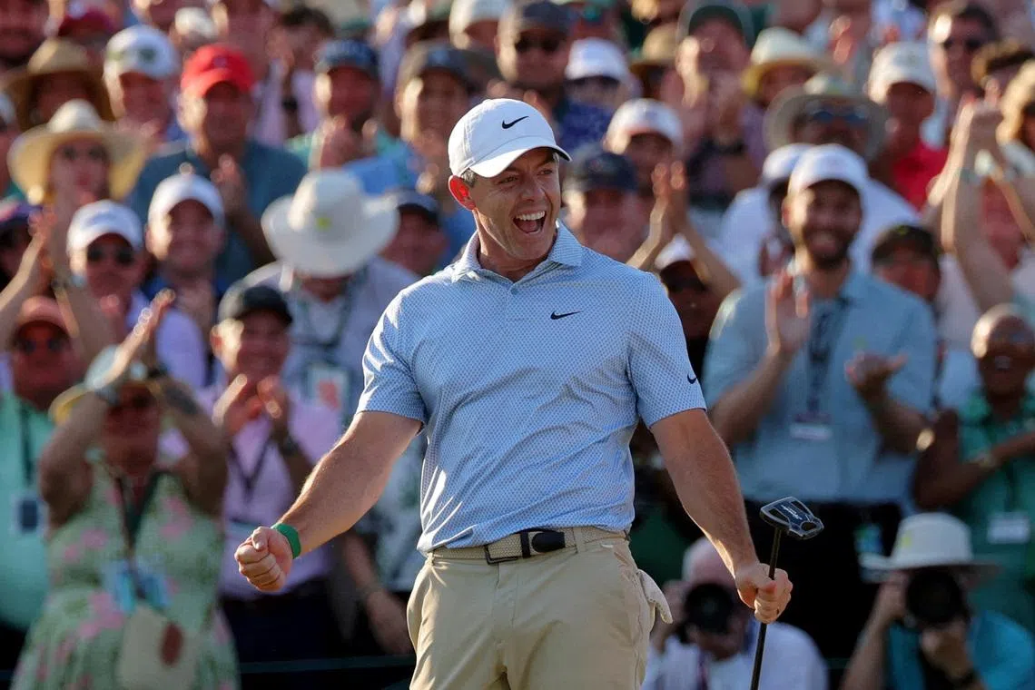 Golf - The Masters - Augusta National Golf Club, Augusta, Georgia, U.S. - April 12, 2026 Northern Ireland's Rory McIlroy celebrates on the green on the 18th hole after winning The Masters REUTERS/Mike Segar