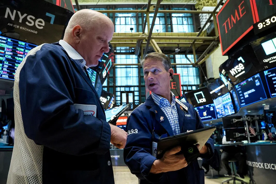 Traders work on the floor of the New York Stock Exchange.