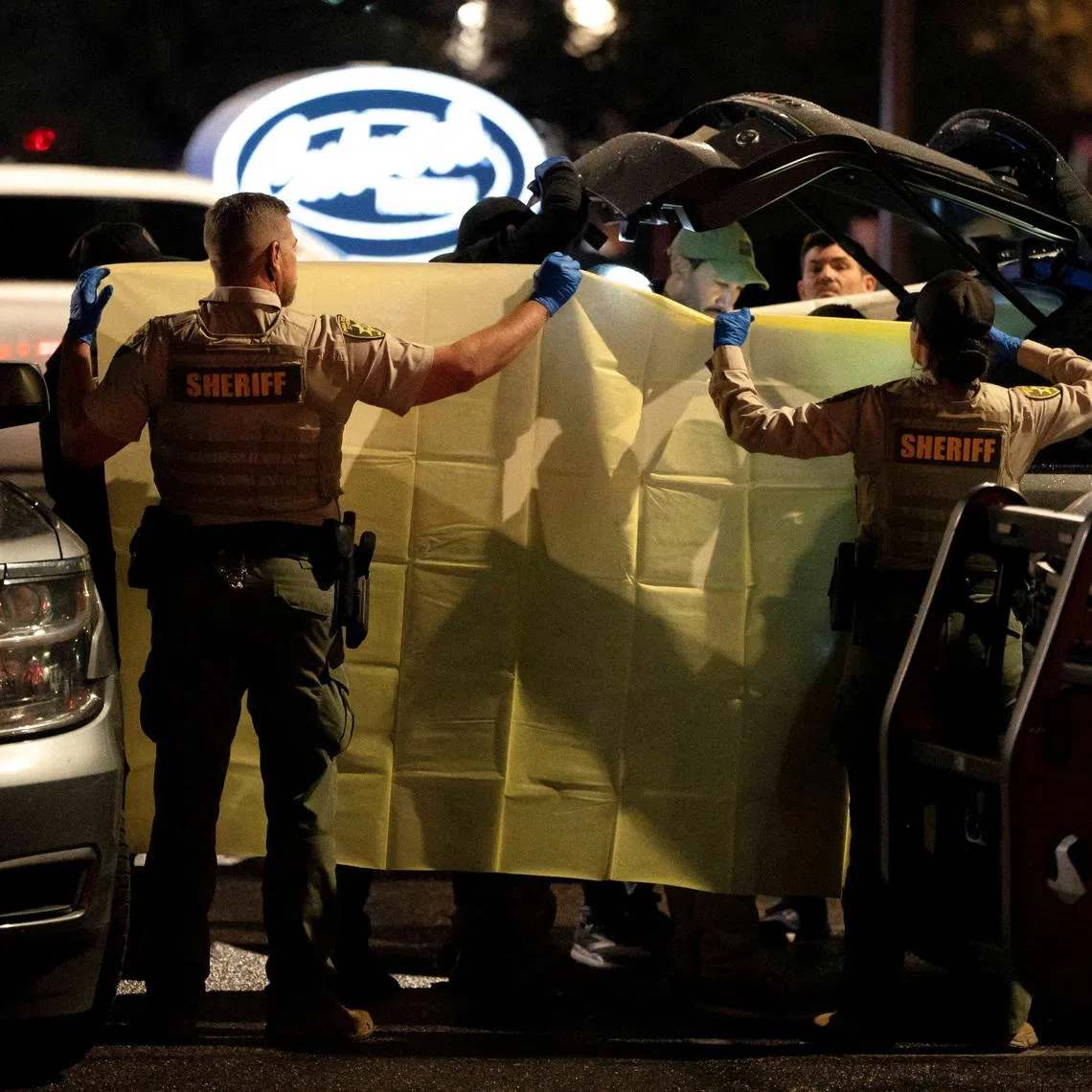 The FBI and Pima County Sheriff’s Department deputies process evidence from a late-model, gray Range Rover as they investigate the disappearance of Nancy Guthrie, the 84-year-old mother of U.S. journalist and television host Savannah Guthrie, at a Culver’s in Tucson, Arizona, U.S. February 13, 2026.  REUTERS/Rebecca Noble     TPX IMAGES OF THE DAY