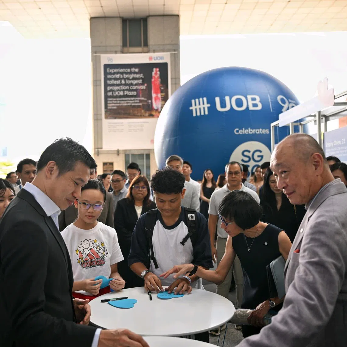 Acting Minister for Culture, Community and Youth David Neo (left) and UOB chief executive and deputy chairman Wee Ee Cheong at an event held as part of efforts to mark UOB’s 90th year.