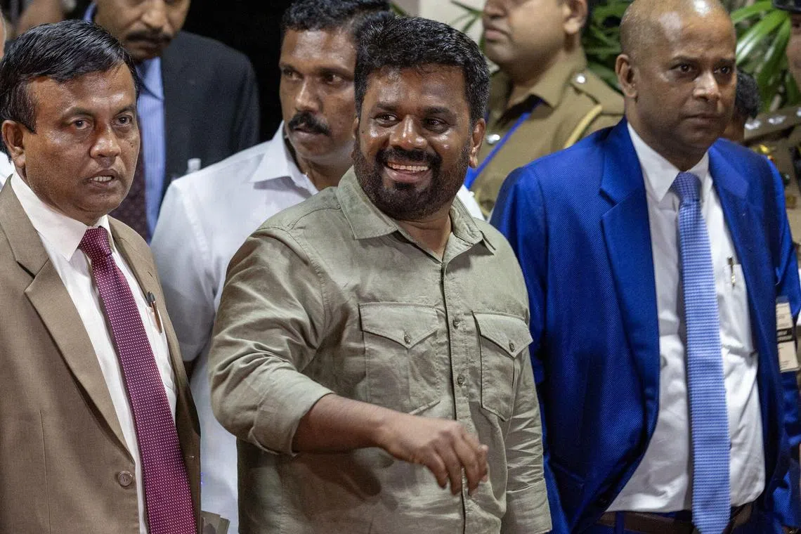 Anura Kumara Dissanayake, Sri Lanka's president-elect (centre), leaving the Sri Lankan Election Commission after the announcement of the presidential election results in Colombo on Sept 22. 