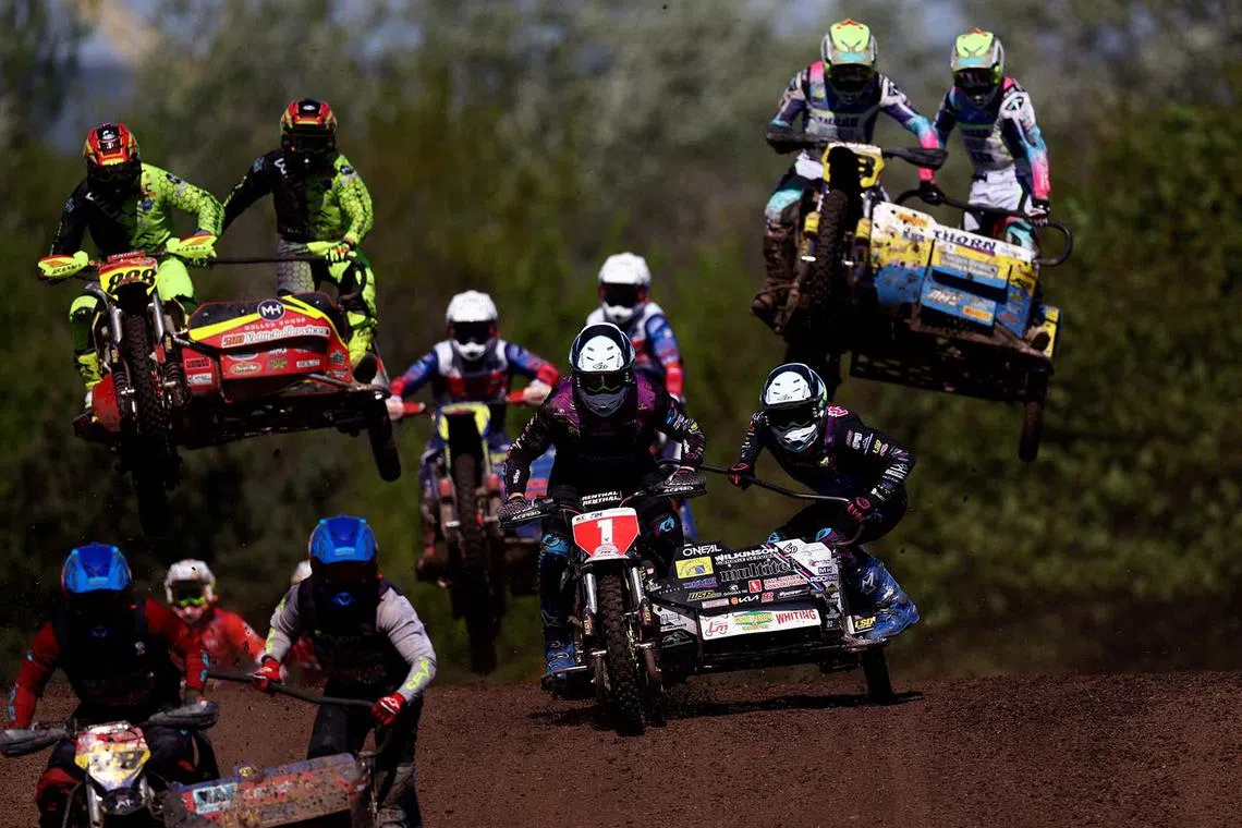 Riders competing during the NETT British Sidecar and Quad Cross Championships at the Iron Works Moto Park in Middlesbrough, Britain, April 27, 2025.