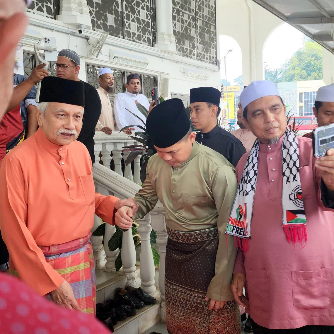 The Yang di-Pertuan Besar of Negeri Sembilan Muhriz Munawir is greeted by supporters as he leaves Yamtuan Raden Jamek Mosque after Friday prayers in Kuala Pilah, Negeri Sembilan on July 24.