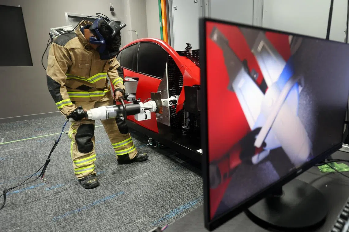 CMG20230720-SeyuTW02/萧紫薇/黄俊贤/EMBARGO until 24 July 6pm. HTX's Extended Reality simulation system for SCDF training. HTX is working with the Singapore Civil Defence Force (SCDF) to use Extended Reality (XR) simulation system to augment SCDF officers’ training. The XR system, jointly developed with SCDF and the National University of Singapore, features a first-of-its-kind multi-sensory suit. SCDF officers wearing the multi-sensory suit will experience the sense of sight, hearing, smell, touch and ability to sense heat in a virtual environment, allowing for realistic training scenarios to be replicated via XR technology. This provides SCDF officers an immersive training experience to bring about greater training effectiveness and ultimately enhance SCDF’s capability and resilience in its emergency response operations. [Civil Defence Academy 101 Jalan Bahar]
