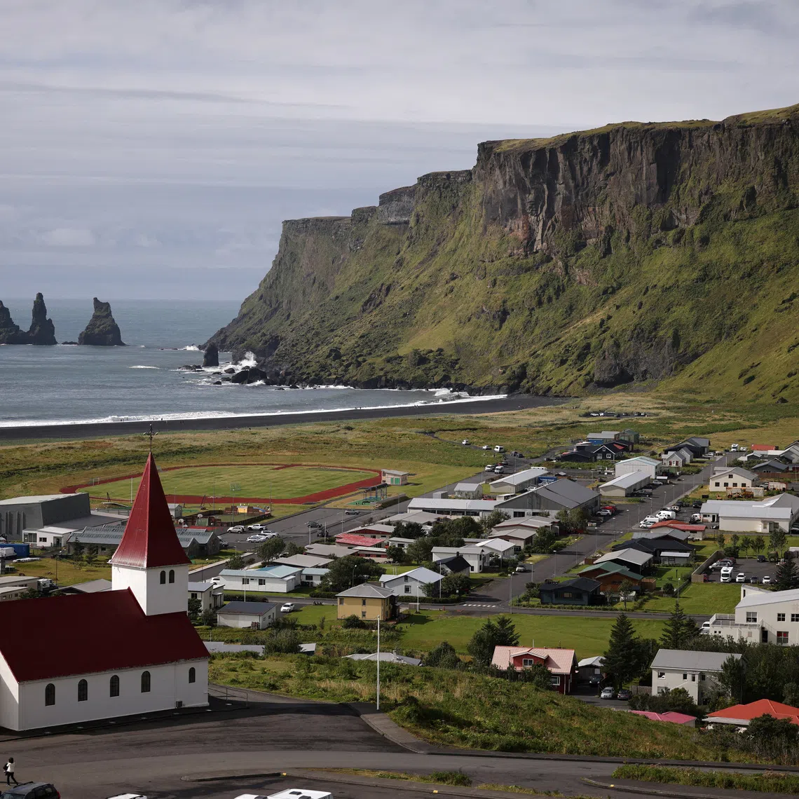 FILE PHOTO: A general view shows the village of Vik, which would be at risk of glacier floods if the Katla volcano erupts, in southwestern Iceland, August 13, 2024. REUTERS/Stoyan Nenov/File Photo