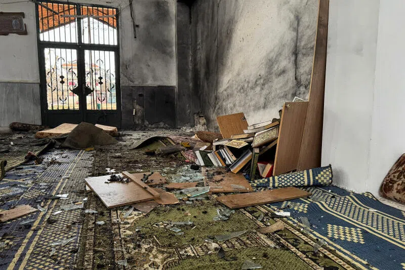 The interior of a damaged mosque after several people were killed in an explosion at a mosque of the Alawite minority sect in Homs, Syria, on Dec 26.