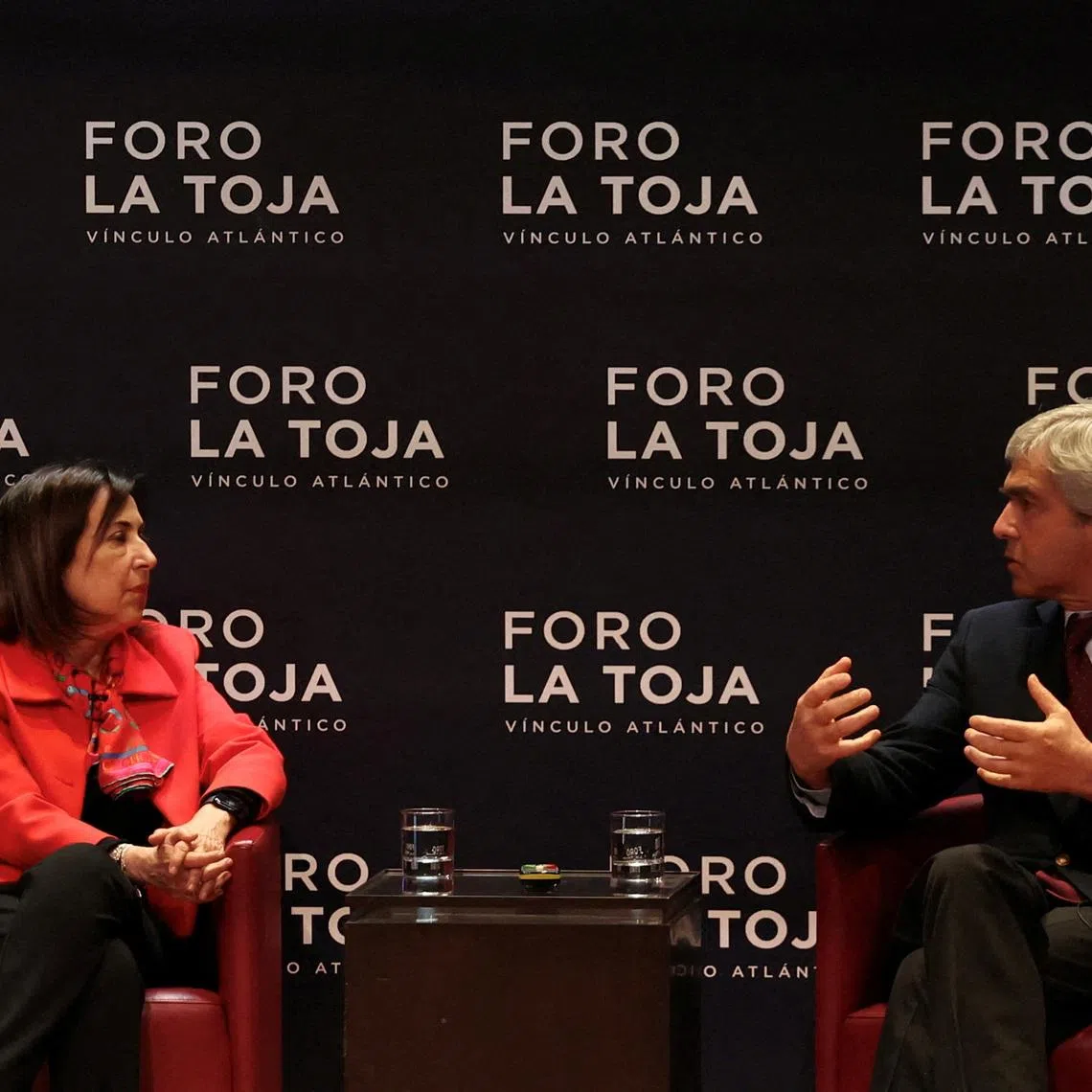FILE PHOTO: Portuguese Defence Minister, Nuno Melo speaks with Spanish Defence Minister Margarita Robles during the La Toja Forum on global challenges in Lisbon, Portugal, April 1, 2025. REUTERS/Pedro Nunes/File Photo