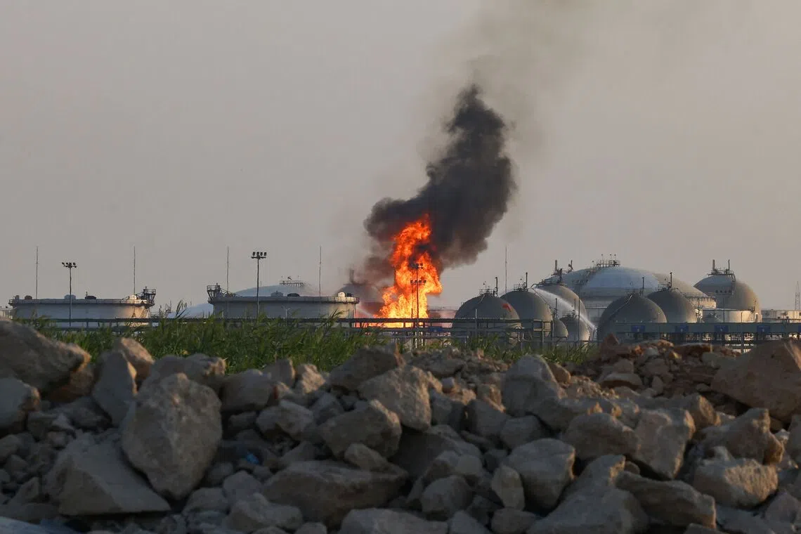 Flames burning at a facility belonging to Saudi oil giant Aramco south of Riyadh on Oct 3, following attacks by the Houthis.