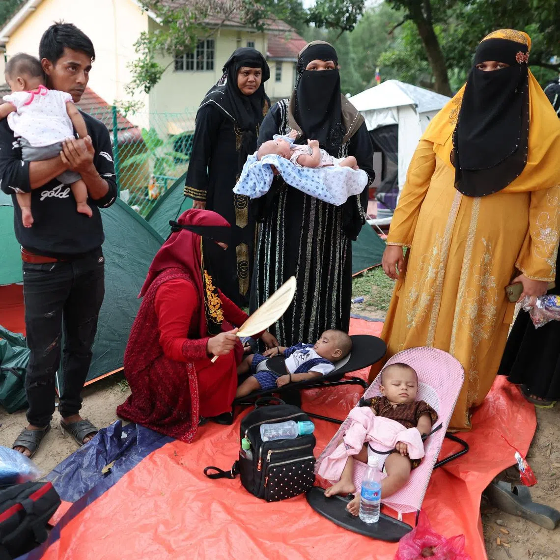 Rohingya refugees gathering in front of the office of the UN refugee agency in Kuala Lumpur on July 27 after being evicted from their homes.