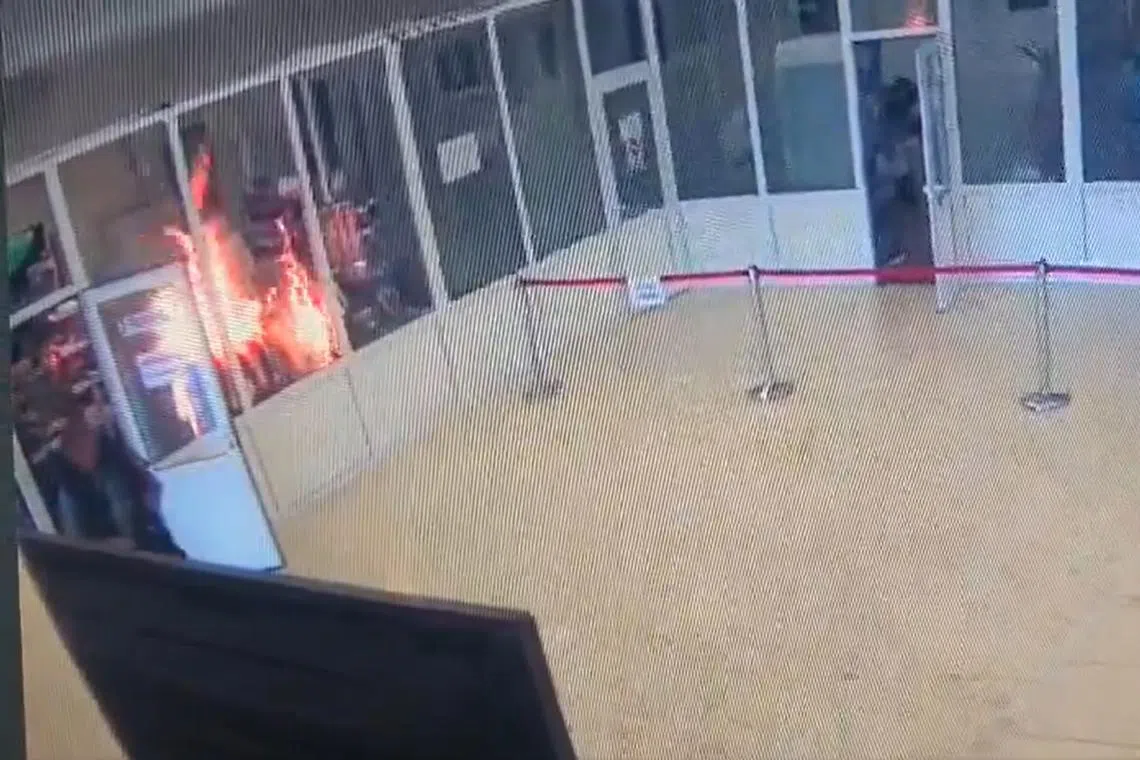 A man threw a flammable liquid and set light to it after getting into an argument near an exhibition hall inside the building. 