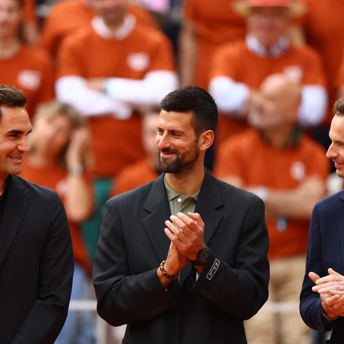 Tennis - French Open - Roland Garros, Paris, France - May 25, 2025 Switzerland's Roger Federer, Serbia's Novak Djokovic and Britain's Andy Murray during a tribute to former player and record French Open winner Rafael Nadal REUTERS/Lisi Niesner