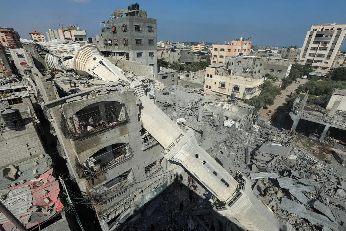 The collapsed minaret of Abdullah Azzam mosque leans against a house after the mosque was hit by an Israeli strike, amid the Israel-Hamas conflict, in Nuseirat refugee camp in the central Gaza Strip, July 17, 2024. REUTERS/Ramadan Abed