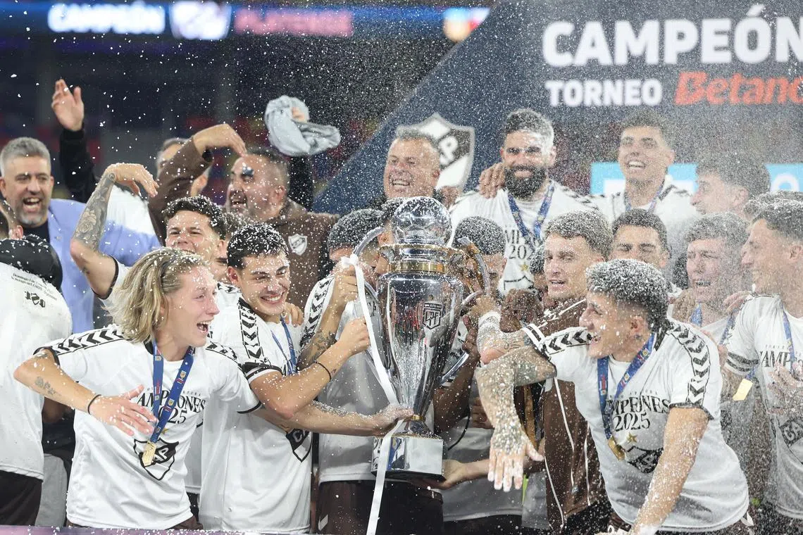 Platense players celebrate after the final of the Apertura First Division Tournament final against Huracan in Santiago del Estero, Argentina on June 1, 2025.