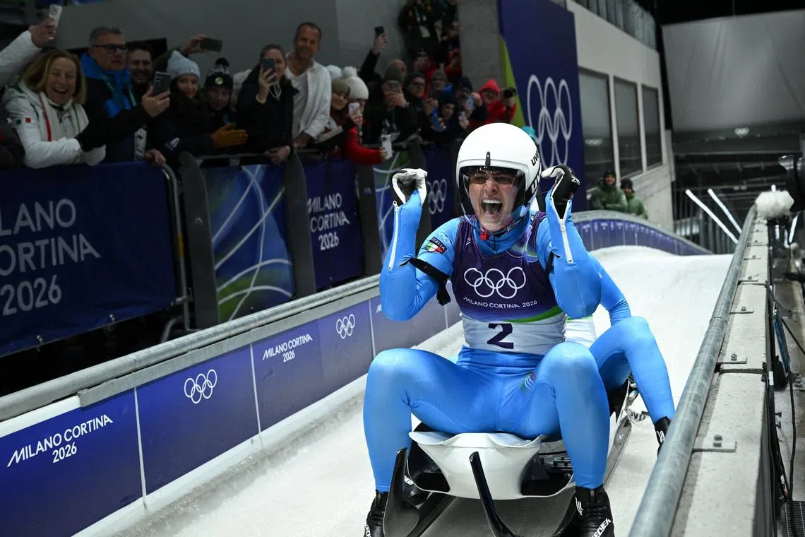 Milano Cortina 2026 Olympics - Luge - Women's Doubles Run 2 - Cortina Sliding Centre, Cortina d'Ampezzo, Italy - February 11, 2026. Andrea Voetter of Italy and Marion Oberhofer of Italy react after their run during Women's Doubles Run 2. REUTERS/Annegret Hilse