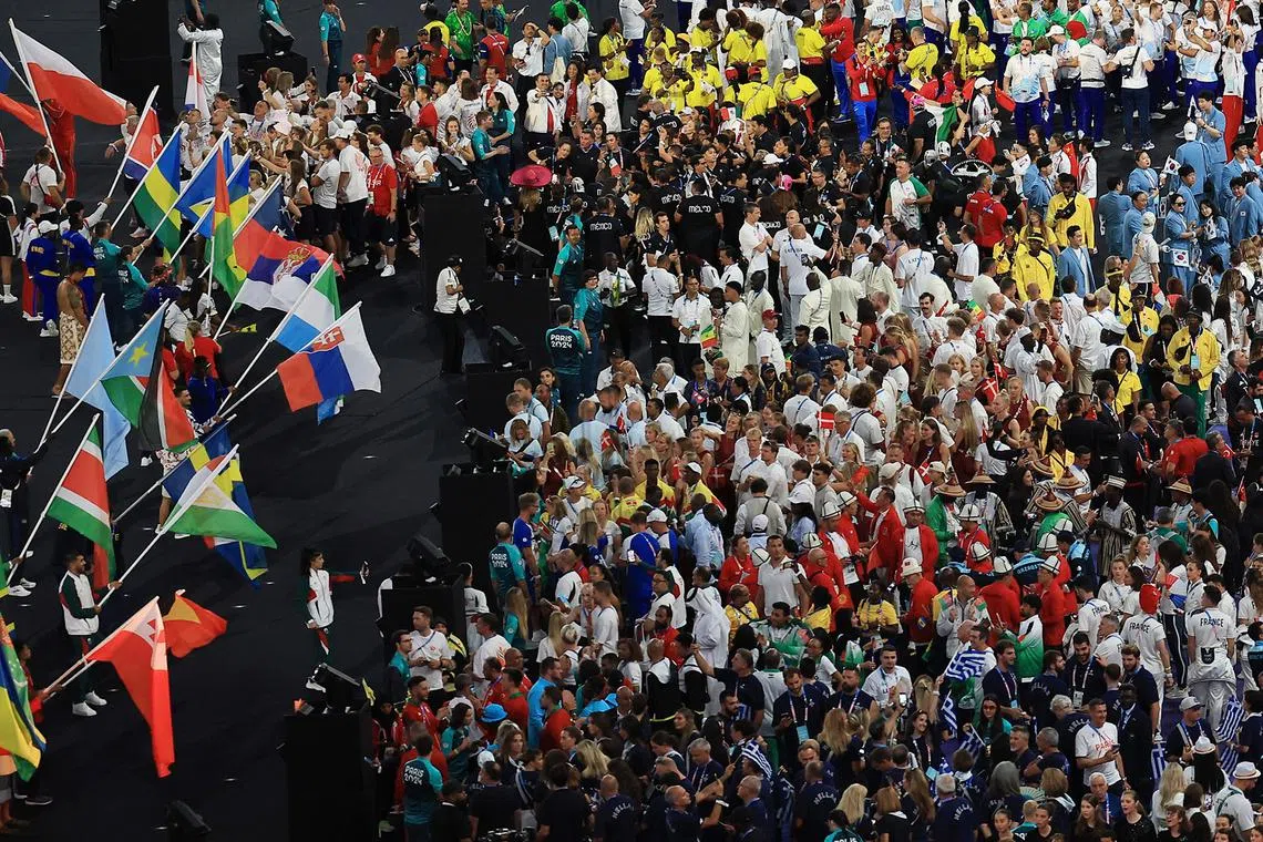 Athletes from various countries mingle during the closing ceremony of the Paris Olympics at the Stade de France on Aug 11, 2024.