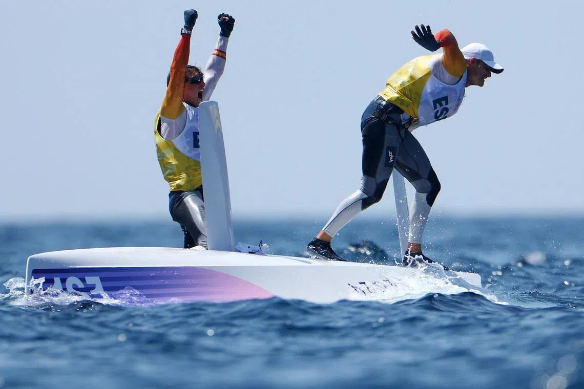 FILE PHOTO: Paris 2024 Olympics - Sailing - Men's Skiff Medal Race - Marseille Marina, Marseille, France - August 02, 2024. Florian Trittel Paul of Spain and Diego Botin le Chever of Spain celebrate after winning gold. REUTERS/Lisi Niesner