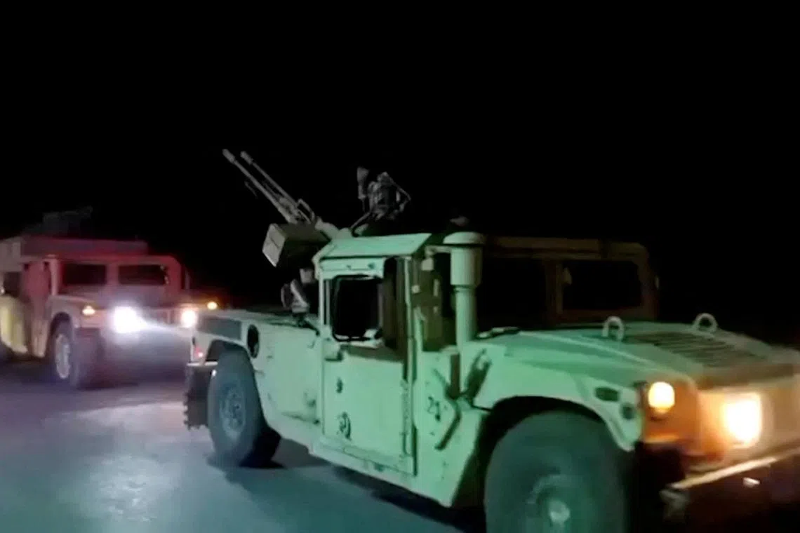Military vehicles move on a road in a location given as Nangarhar, Afghanistan, in this screengrab from a handout video released on February 26, 2026. Pakistani and Afghan border forces clashed on Thursday night after the Taliban launched what it called retaliatory strikes on Pakistani installations, sharply escalating tensions after days of cross-border hostilities.   Afghanistan's Ministry of Defense/Handout via REUTERS
