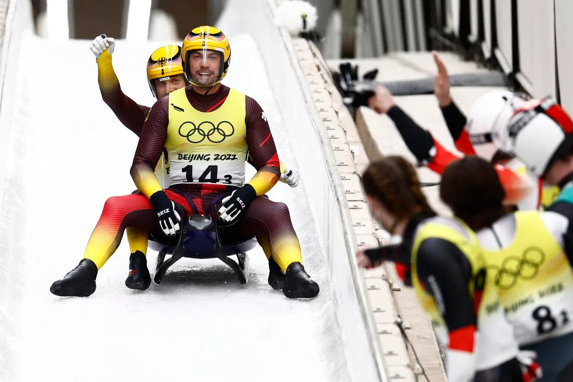 FILE PHOTO: 2022 Beijing Olympics - Luge - Team Relay Competition - National Sliding Centre, Beijing, China - February 10, 2022. Tobias Wendl of Germany and Tobias Arlt of Germany react after winning gold. REUTERS/Thomas Peter/ File Photo