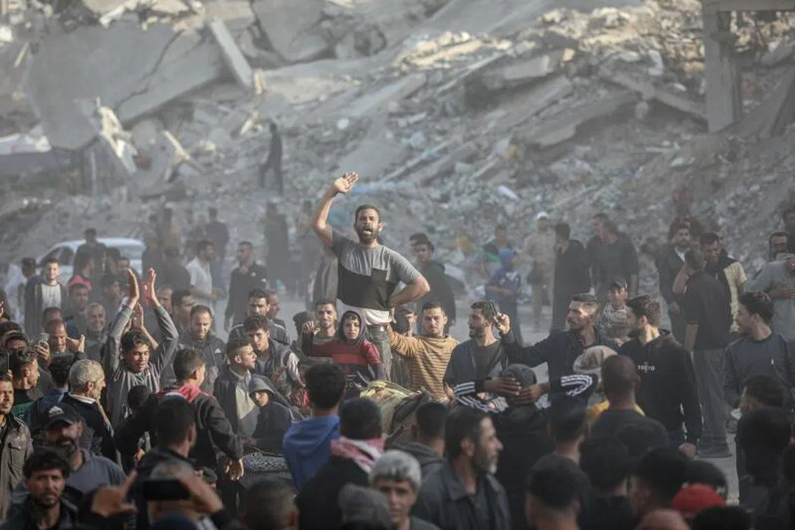 Palestinians protest against the Hamas militant group during a demonstration in Beit Lahiya, northern Gaza, on Wednesday, March 26, 2025. Protesters called on Hamas to relinquish control of Gaza and end the 18-month war with Israel that’s killed tens of thousands of people. Photographer: Ahmad Salem/Bloomberg