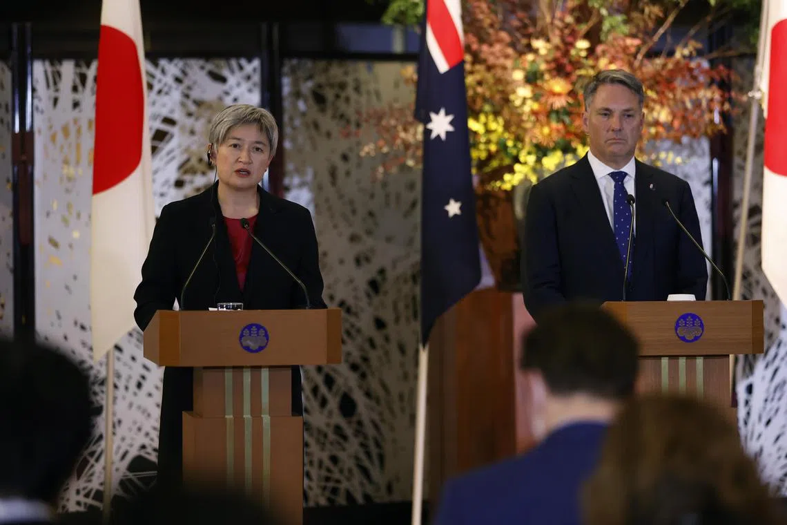 Australia's Foreign Minister Penny Wong (L) and Defence Minister Richard Marles (R) attend a joint news conference in Tokyo, Japan, on Dec 9, 2022. 