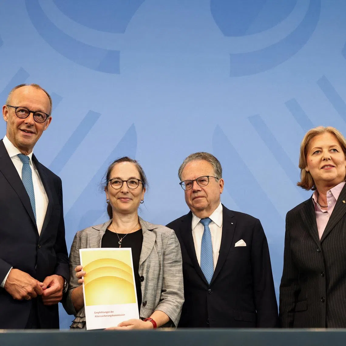 German Chancellor Friedrich Merz, Labour Minister Baerbel Bas, Constanze Janda, and Frank-Jurgen Weise pose at a press conference on the day they present the  Pension Security Commission (Alterssicherungskommission) report, at the Chancellery in Berlin, Germany, June 23, 2026. REUTERS/Nadja Wohlleben