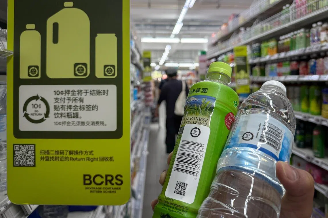 Bottled and canned drinks with the BCRS Deposit Mark seen on shelves at a supermarket in Lorong 4 Toa Payoh on Oct 1, the day the Beverage Container Return Scheme takes effect.