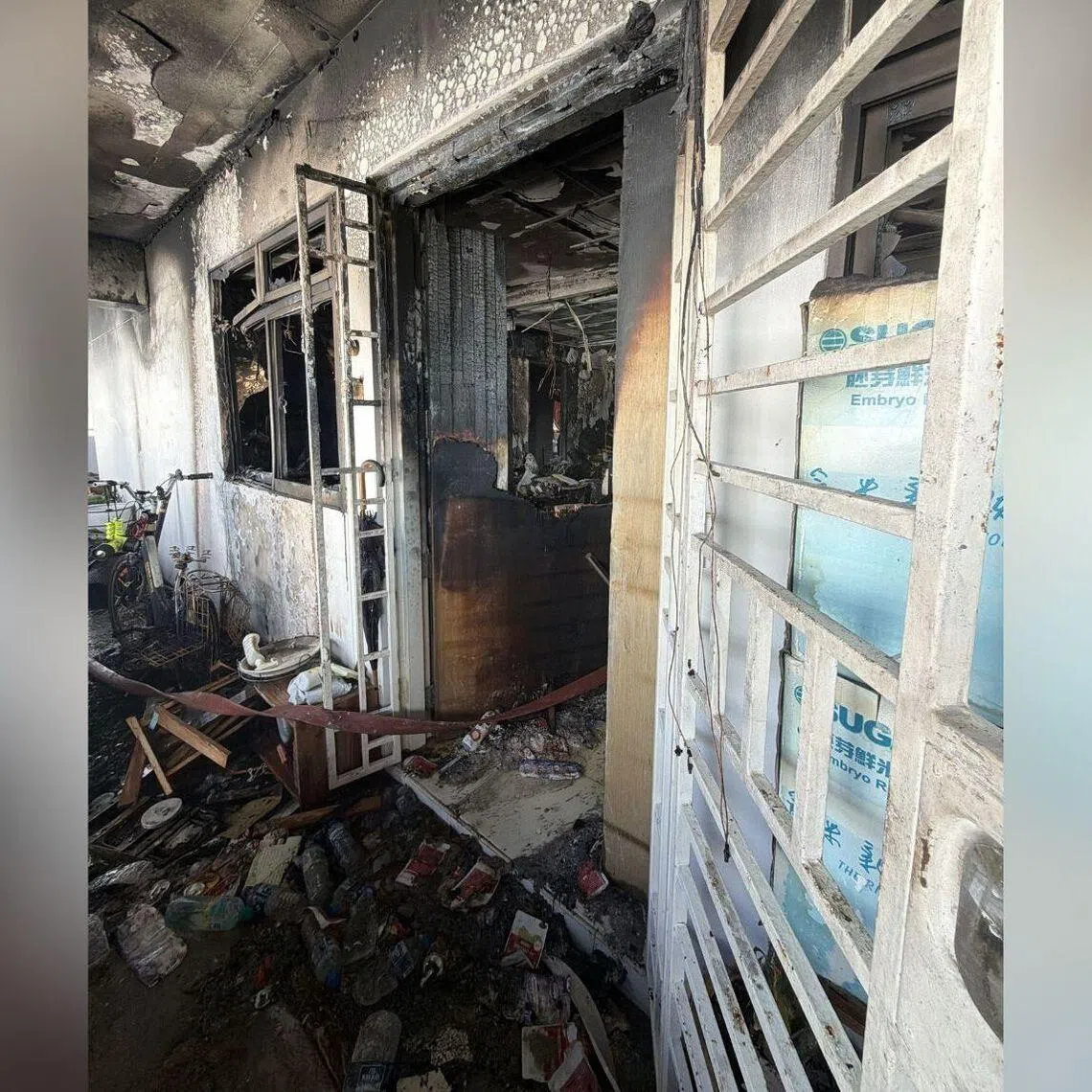 In a photo of the aftermath of the fire, parts of the ceiling, window and furniture of the affected unit appear to have been damaged.