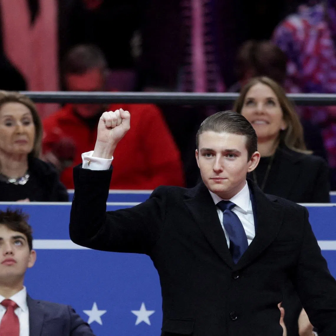 FILE PHOTO: Barron Trump gestures during a rally on the inauguration day of U.S. President Donald Trump's second Presidential term, inside Capital One, in Washington, U.S. January 20, 2025. REUTERS/Mike Segar/File Photo