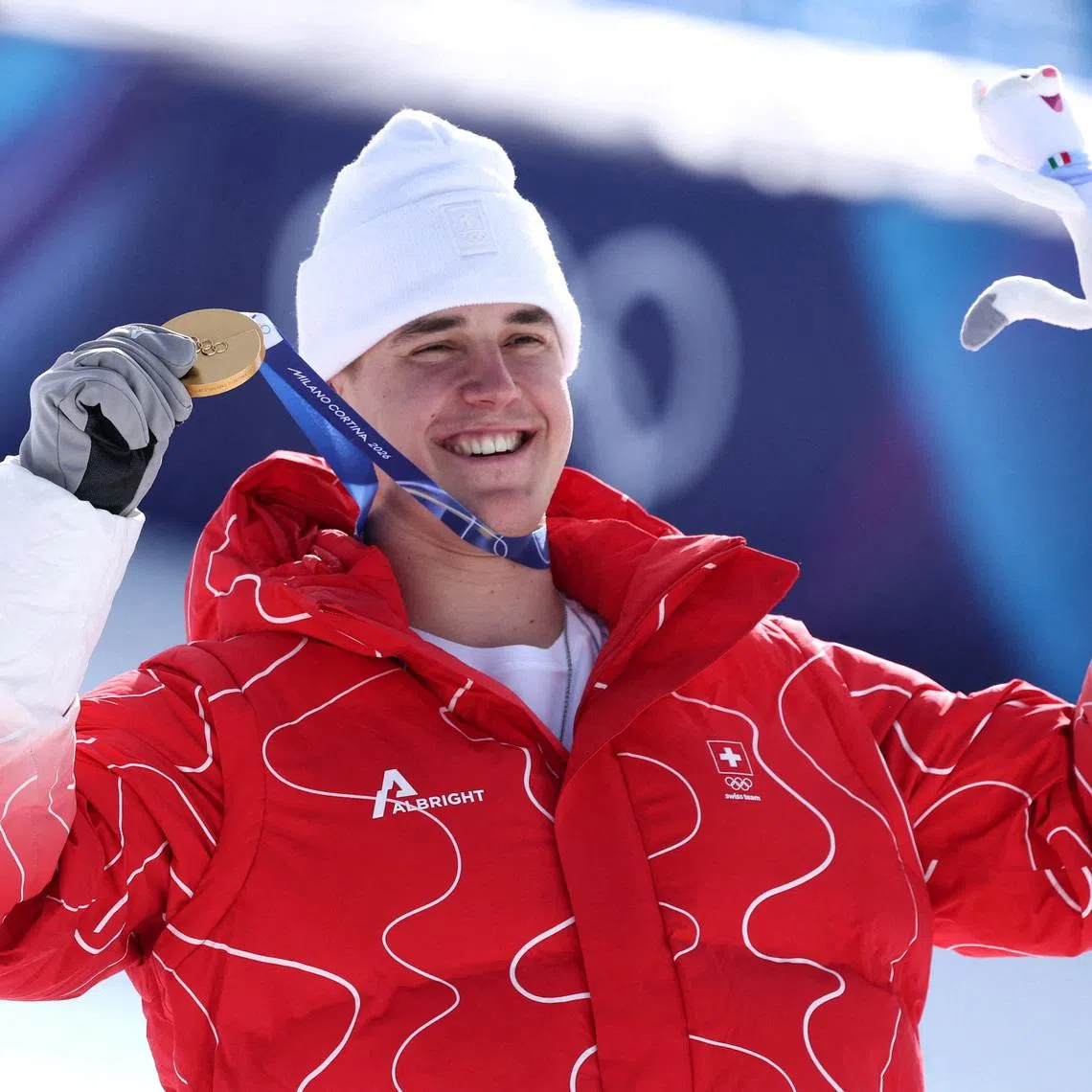 Milano Cortina 2026 Olympics - Alpine Skiing - Men's Downhill Victory Ceremony - Stelvio Ski Centre, Bormio, Italy - February 07, 2026. Gold medallist Franjo von Allmen of Switzerland celebrates on the podium after winning the Men's Downhill REUTERS/Gintare Karpaviciute
