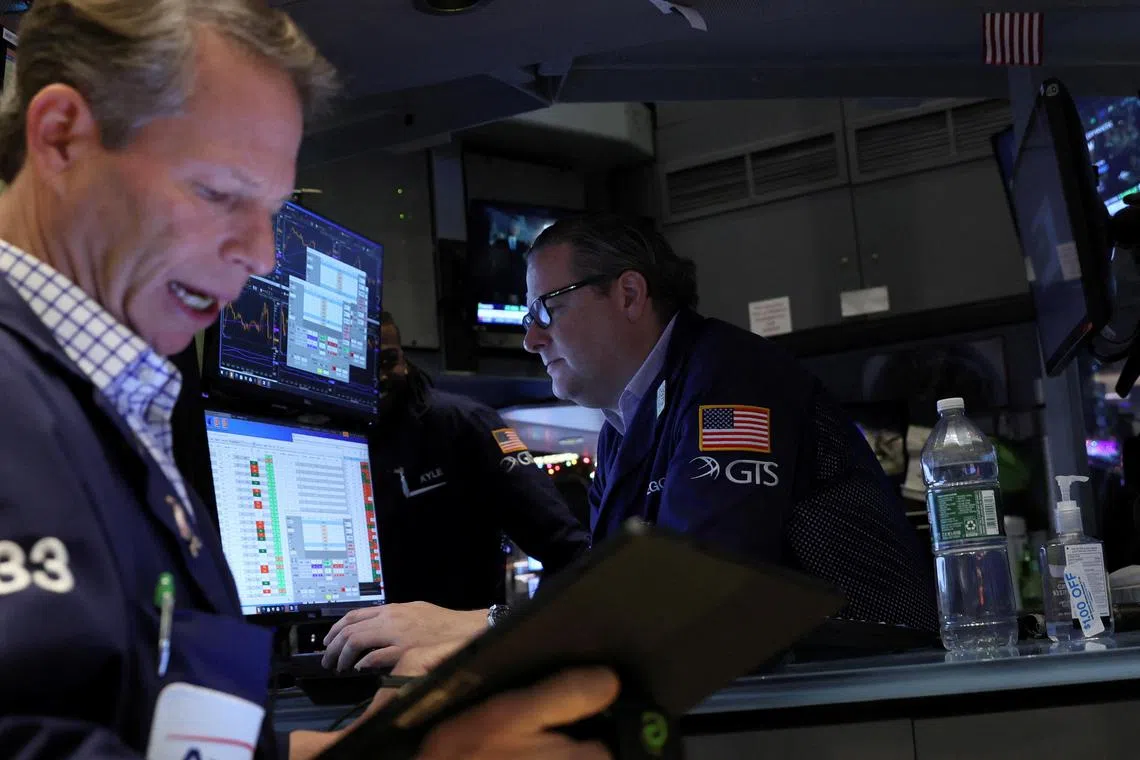 Traders work on the floor of the New York Stock Exchange, on Dec 9, 2022.