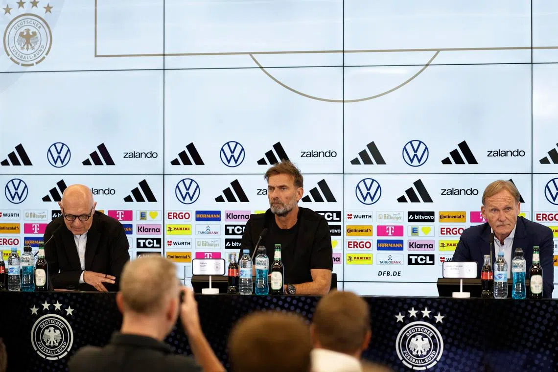 Soccer Football - Germany DFB announces new manager of national soccer team - DFB Campus, Frankfurt, Germany - July 24, 2026 Juergen Klopp, newly appointed manager of German national soccer team, attends a press conference with DFB President Bernd Neuendorf and Vice President Hans-Joachim Watzke REUTERS/Heiko Becker