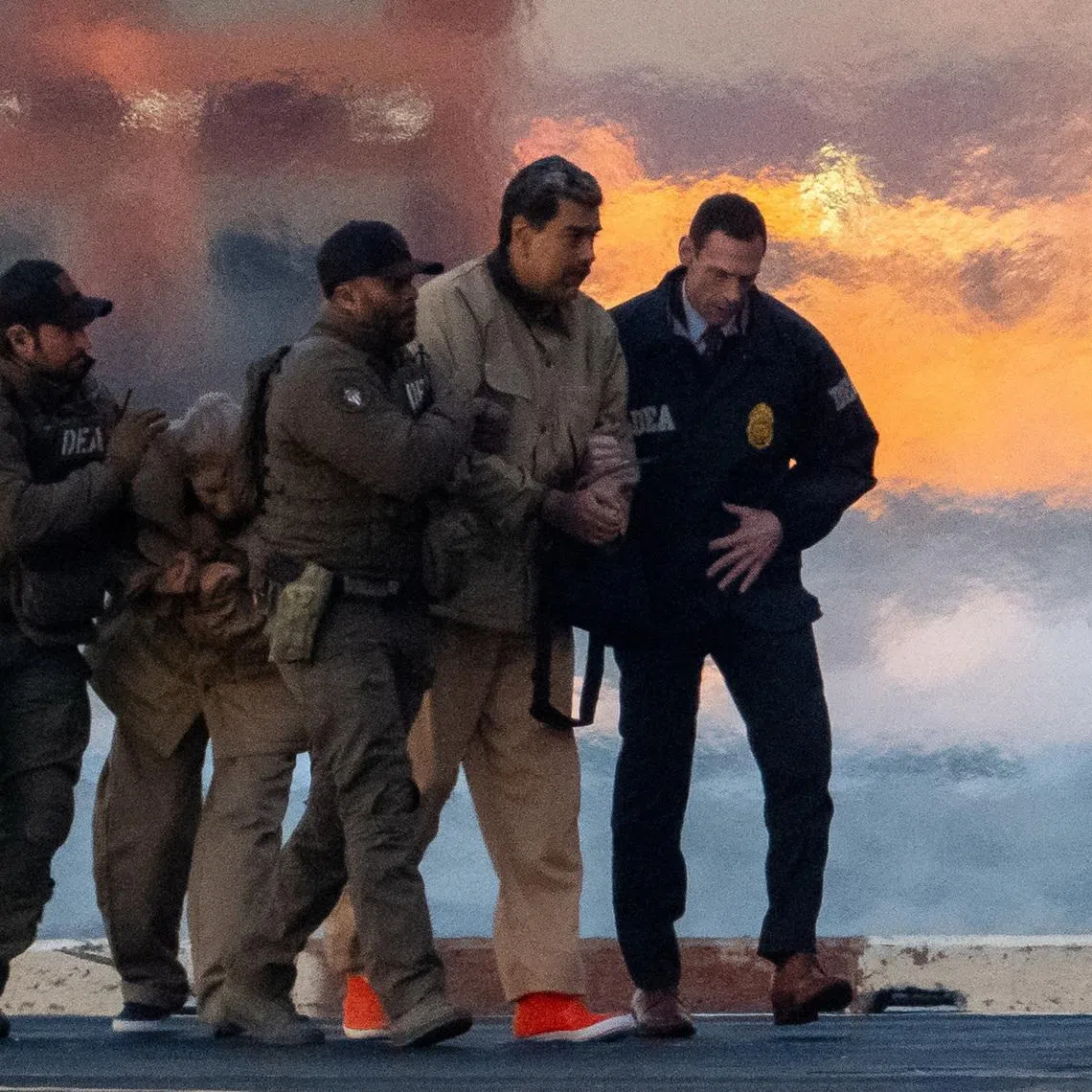 Captured Venezuelan President Nicolas Maduro and his wife Cilia Flores being escorted to a courthouse in New York on Jan 5.