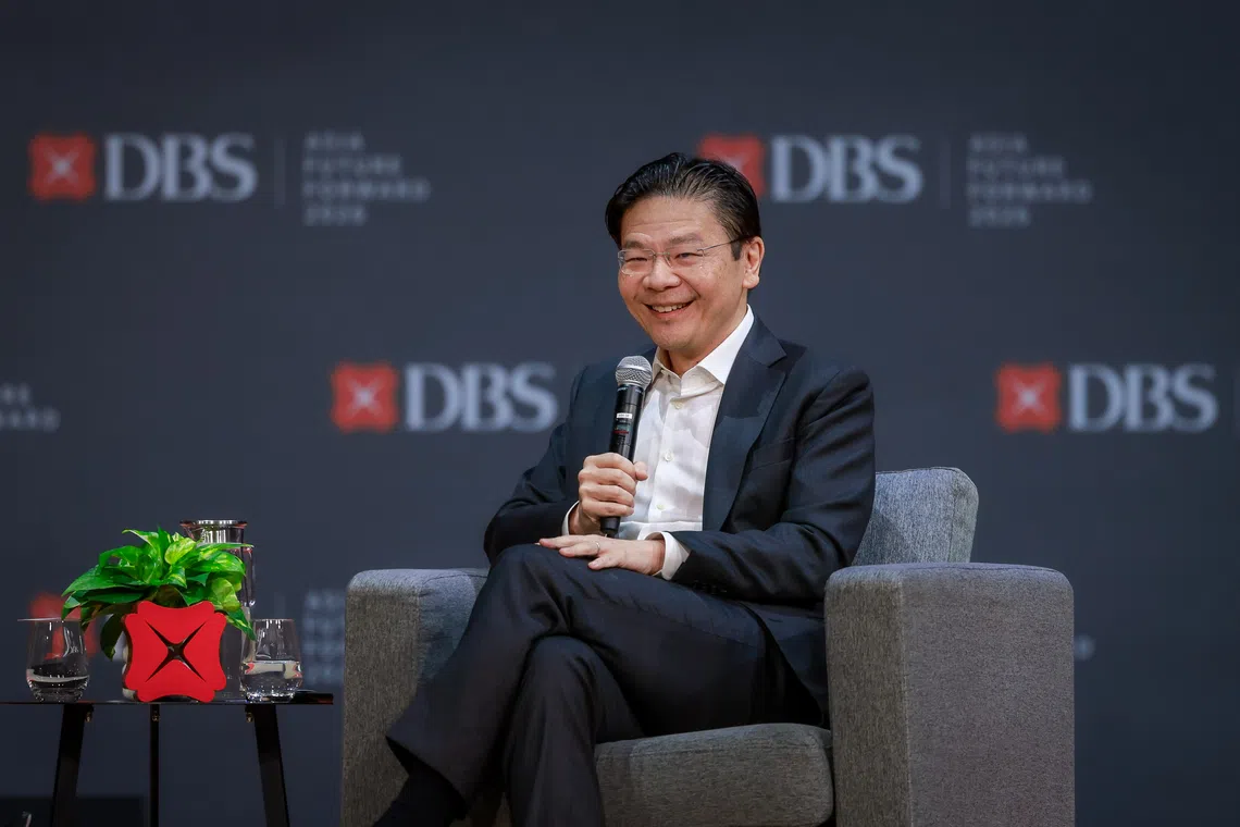 Prime Minister Lawrence Wong speaks at the DBS Asia Future Forward Conference at Suntec Convention and Exhibition Centre on Oct 12.